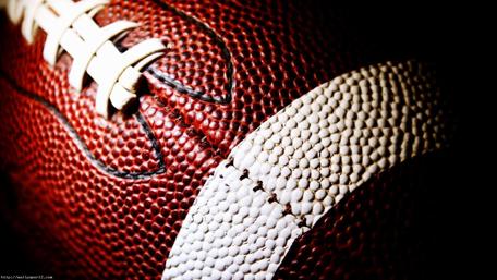 Close-Up Shot of a Football Highlighting Texture wallpaper
