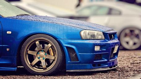 Sleek Blue Sports Car Extravaganza wallpaper
