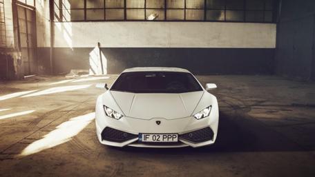 Sleek White Dream Car in Industrial Setting wallpaper