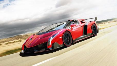 Stunning Red Dream Car on Open Road wallpaper