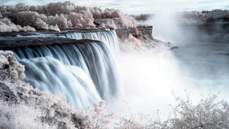 Majestic Waterfall in a Snowy Forest wallpaper