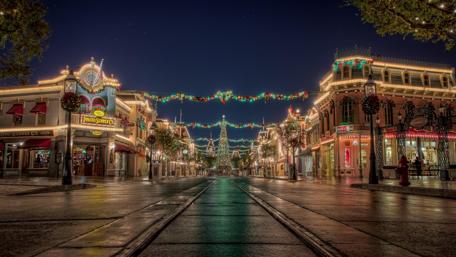 Festive City Street Under Holiday Lights wallpaper