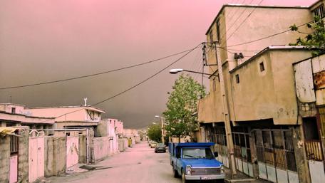 Urban Stormy Skies Over a Quiet Street wallpaper