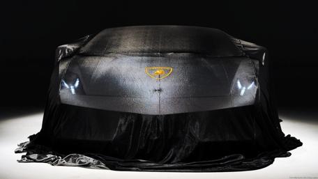 Mysterious Black Sports Car Reveal wallpaper