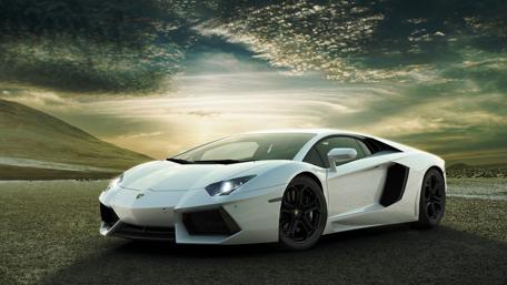 White Exotic Car Under Dramatic Sky wallpaper