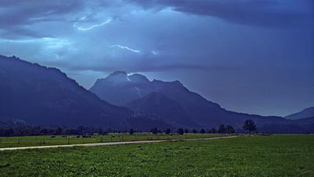 Mysterious Storm Over Majestic Mountains wallpaper