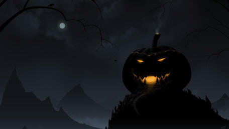 Glowing Pumpkin Against Spooky Night Backdrop wallpaper