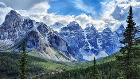 Majestic Mountain Range Under a Blue Sky wallpaper