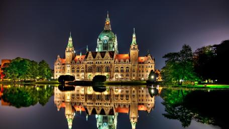 Enchanting Night View of a Castle by the Lake wallpaper