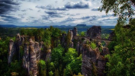 Majestic Rock Formations in Lush Greenery wallpaper