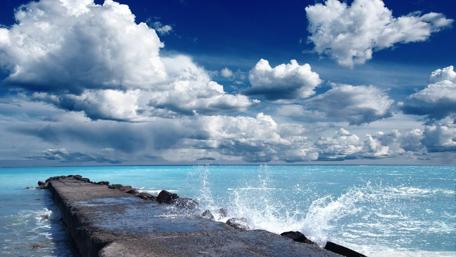Tranquil Pier Overlooking Blue Sea and Sky wallpaper