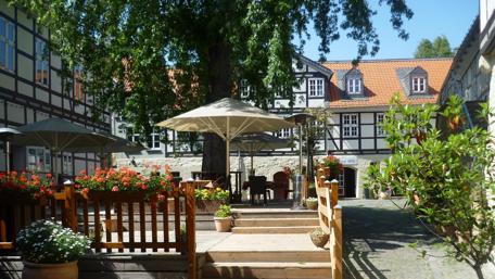 Charming German Courtyard with Flowers and Shade wallpaper