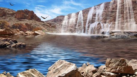 Majestic Waterfall in Rocky Terrain wallpaper