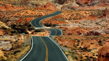 Winding Road Through Vibrant Landscape wallpaper