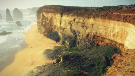 Cliffside Majesty and Ocean Embrace wallpaper
