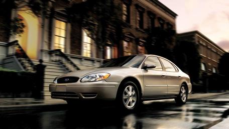 Sleek Ford Taurus in Urban Setting wallpaper