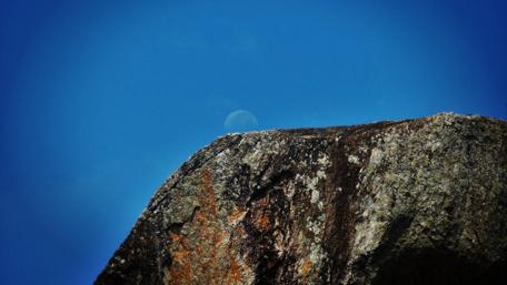 Mystical Moonrise Over Rocky Outcrop wallpaper