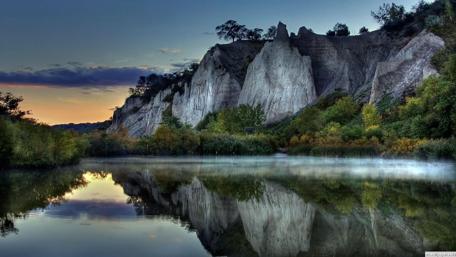 Serene Cliffs Beside Tranquil Waters wallpaper