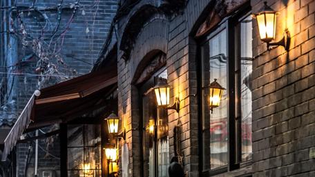 Evening Lights Illuminate Urban Life Moments wallpaper