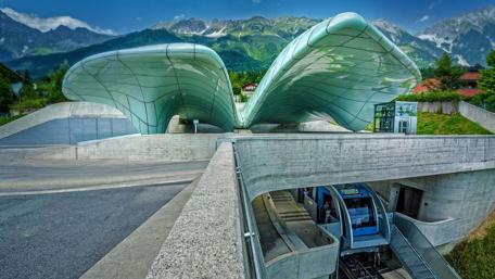 Modern Architecture with Scenic Mountains Background wallpaper