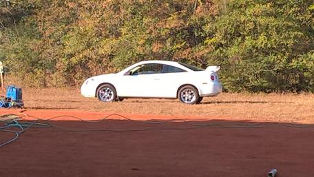 Classic White Car on a Scenic Background wallpaper