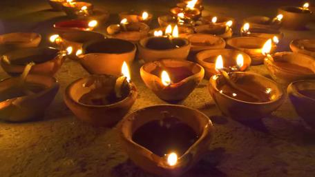 Diwali Lamps Illuminate a Path to Peace and Joy wallpaper
