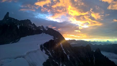 Sunset Over Snowy Mountain Peaks wallpaper