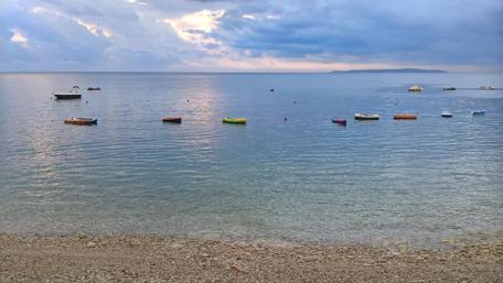 Tranquil Waters and Colorful Boats wallpaper