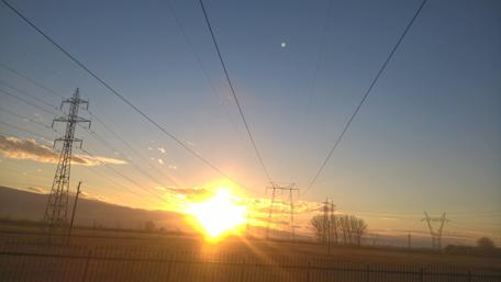 Golden Sunrise Over Power Lines wallpaper