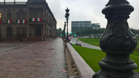 Urban Elegance Under Rainy Skies in Mexico City wallpaper