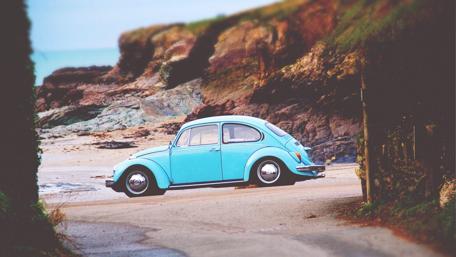 Vintage Adventure with Volkswagen Beetle's Side View wallpaper