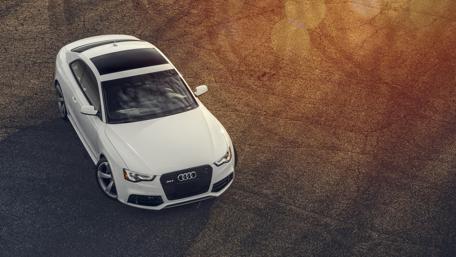 Sleek Audi RS5 on a Dramatic Asphalt Surface wallpaper