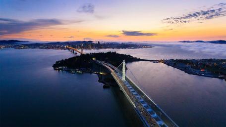 Evening Cityscape Over Stunning Bridge and Islands wallpaper