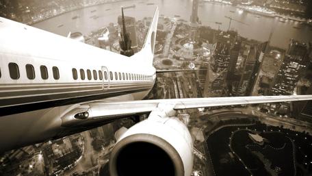 Skyward Journey Over Urban Lights wallpaper