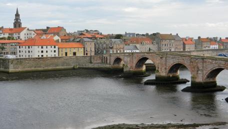 Charming Cityscape by the River wallpaper