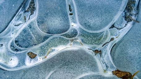 Frozen Fluidity in Nature's Canvas wallpaper