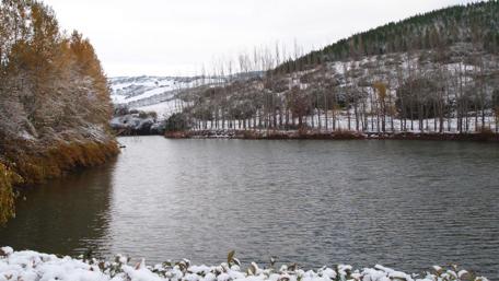 Serene Winter Landscape by the River wallpaper