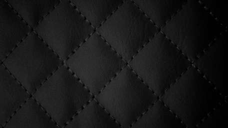 Sleek Black Quilted Design for Modern Aesthetics wallpaper