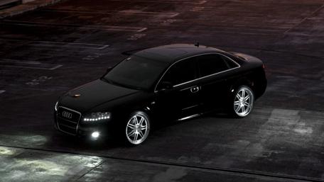 Sleek Audi in Urban Nightscape wallpaper