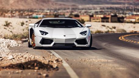 Sleek Lamborghini Aventador on an Open Road Surface wallpaper