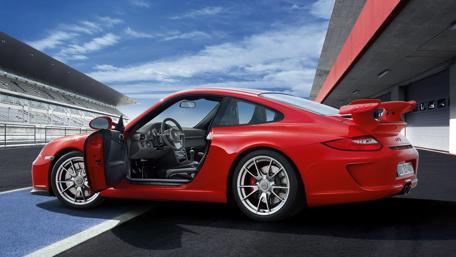 Sleek Red Sports Car on the Track wallpaper