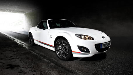 Sleek White Convertible in a Dramatic Tunnel Scene wallpaper