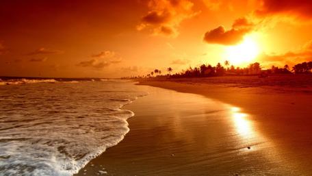 Serene Sunset Over Tranquil Beach Scene wallpaper