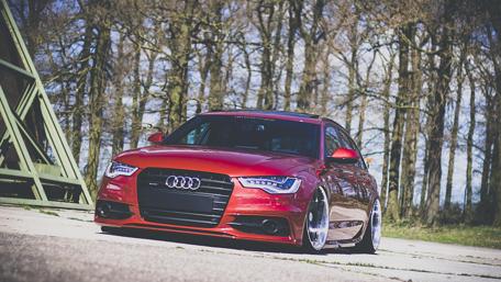 Sleek Red Audi in Nature Scene wallpaper