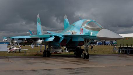 Sleek Military Jet on Display Amidst Dramatic Skies wallpaper