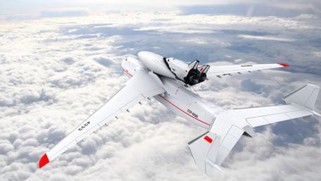 Sleek Military Drone Soars Above the Clouds wallpaper