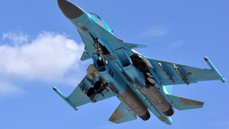 Sleek Fighter Jet in Clear Skies wallpaper