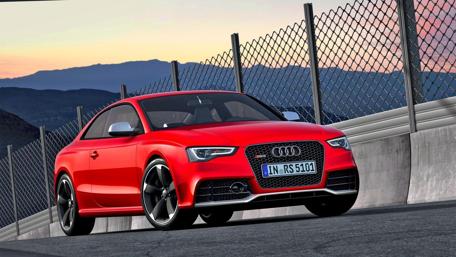 Vibrant Audi RS5 Surrounded by Scenic Landscape wallpaper