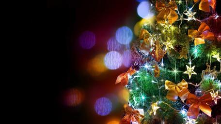 Festive Christmas Tree with Bright Ornaments and Lights wallpaper
