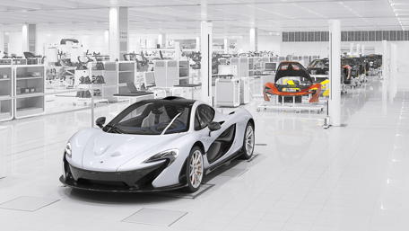 Sleek McLaren P1 in Pristine Factory Setting wallpaper